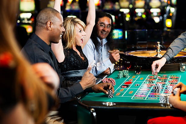 Placing bets on paladintoto No Commission Baccarat Player placing bet on baccarat table via paladintoto app